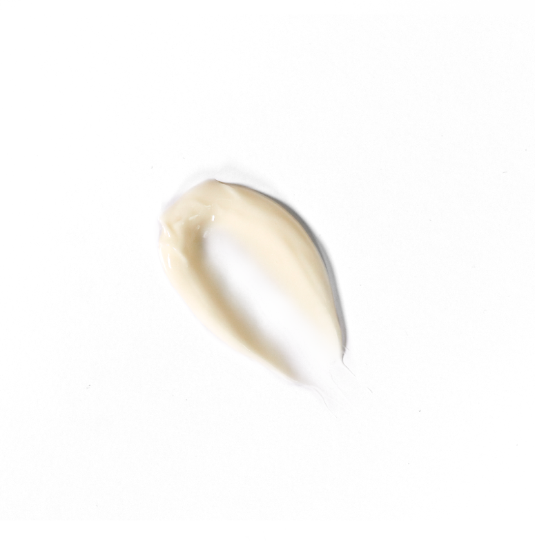 A smear of white cream against a plain background.